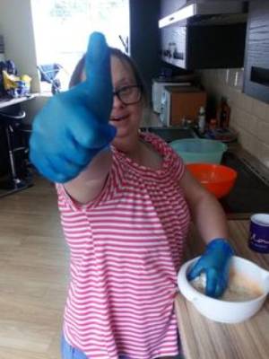 picture of a client baking with thumbs up